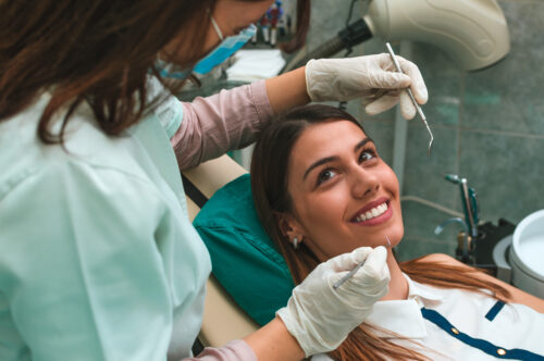 dental hygienist with patient