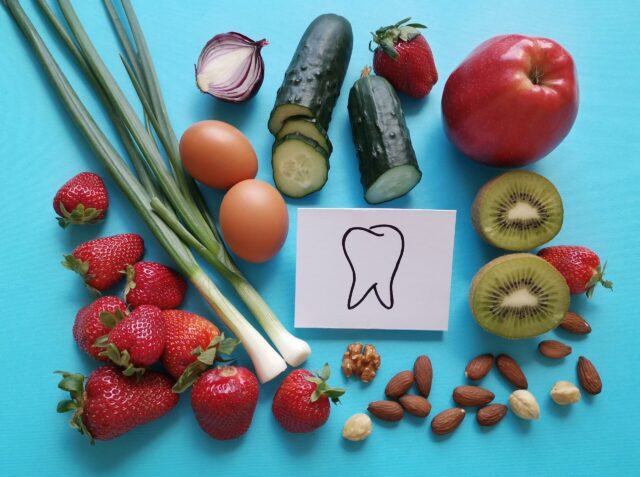 Assortment of food for healthy teeth and healthy smile. Selection of foods for stronger whiter teeth. Best food for oral health and gum health. Concept of dental nutrition.