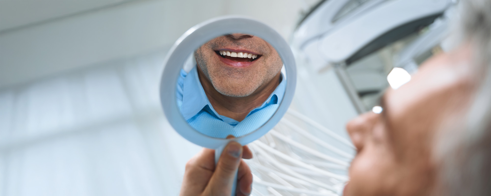 Happy male after whitening in clinic stock photo